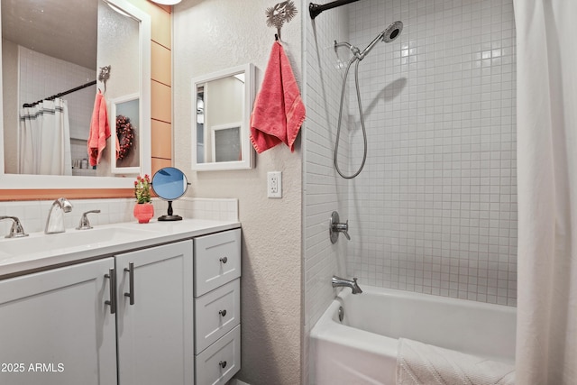 bathroom featuring shower / bath combination with curtain and vanity