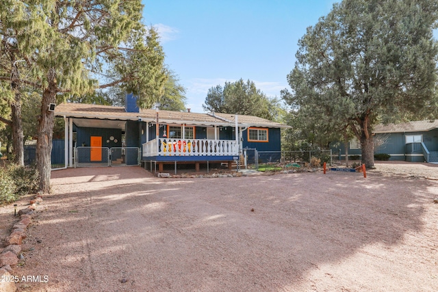 single story home with a carport