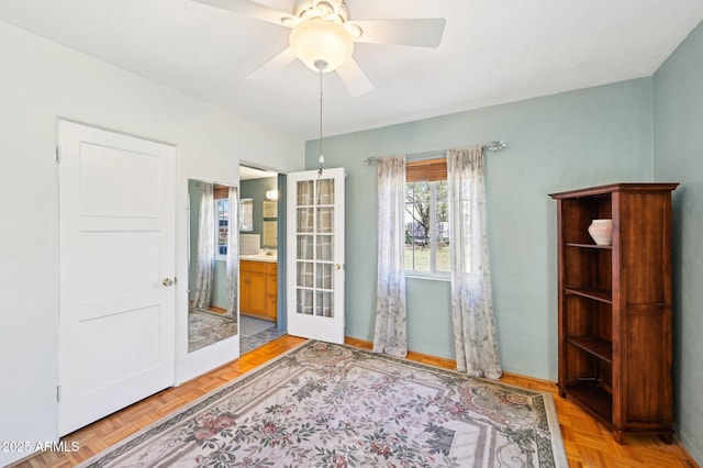 unfurnished bedroom with ensuite bathroom and ceiling fan