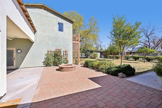 view of patio featuring an outdoor fire pit