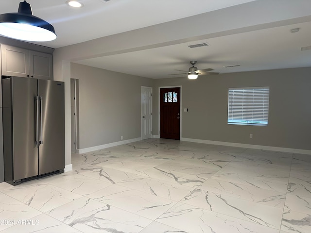 foyer featuring ceiling fan