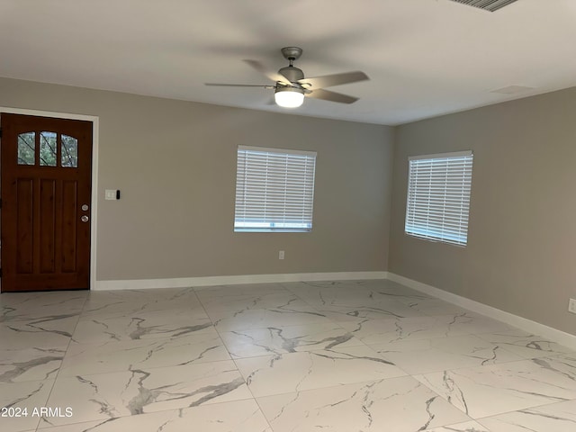 foyer featuring ceiling fan