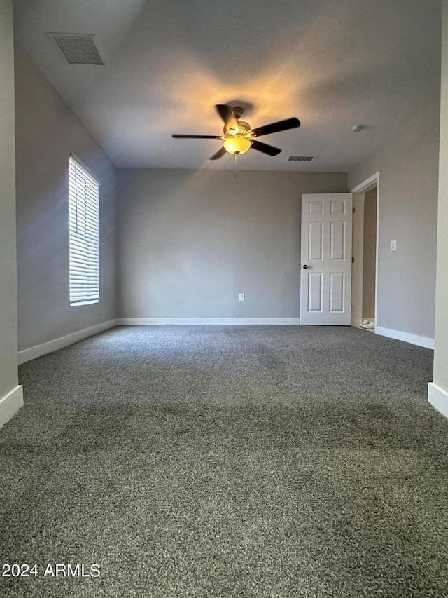 carpeted empty room with ceiling fan