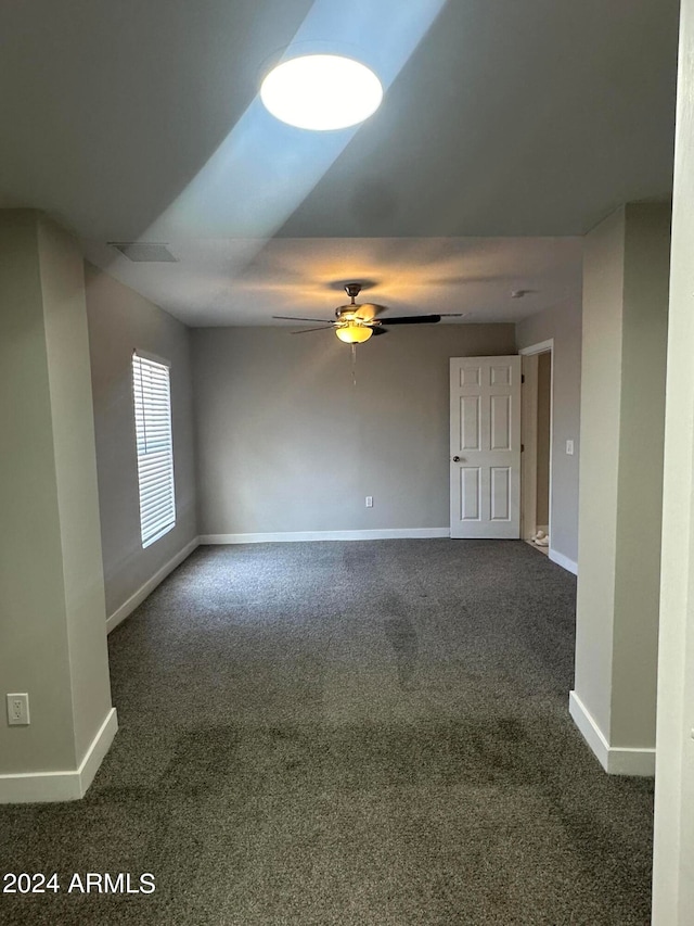 carpeted empty room with ceiling fan