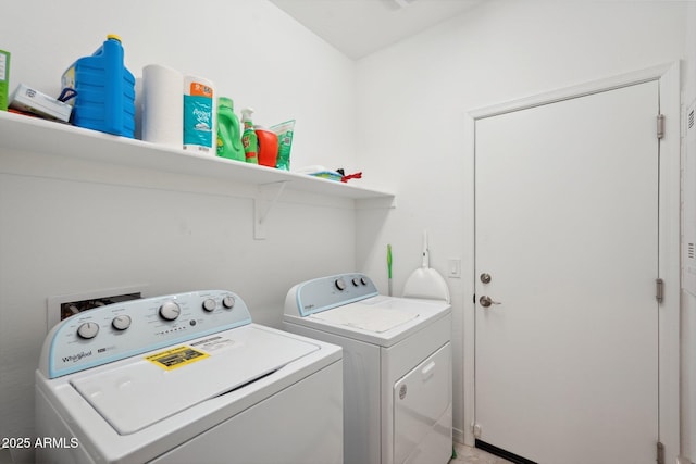 clothes washing area with laundry area and washing machine and clothes dryer