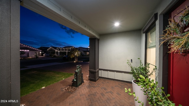 view of patio terrace at dusk