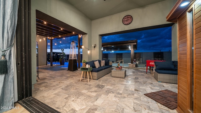 patio terrace at dusk with an outdoor hangout area