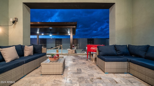 patio terrace at night with an outdoor hangout area