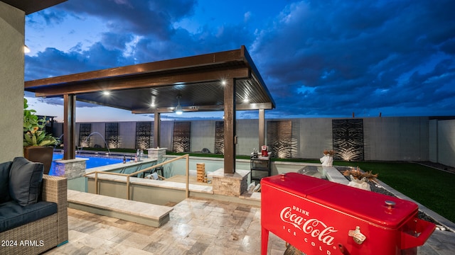 view of terrace featuring a fenced in pool and pool water feature