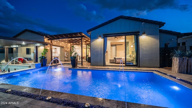 pool at twilight featuring a patio area, a pergola, and pool water feature