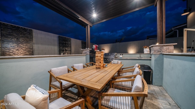 view of patio terrace at night