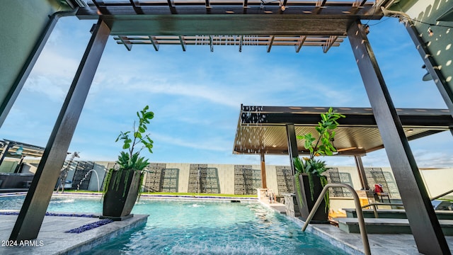 view of pool featuring a pergola and pool water feature