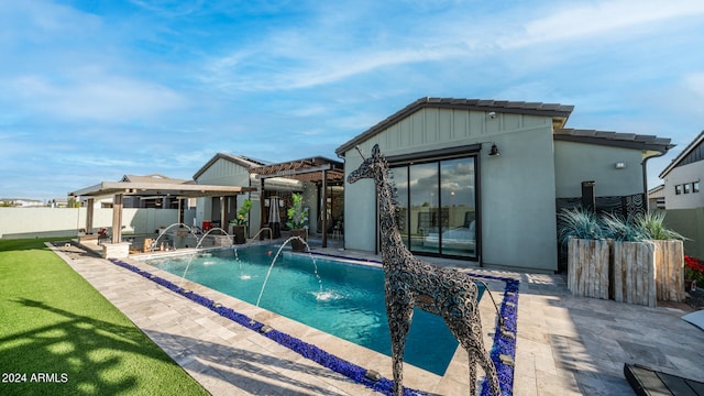 view of swimming pool featuring a pergola, pool water feature, and a patio area