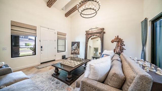 living room featuring an inviting chandelier, a towering ceiling, beam ceiling, and light parquet floors