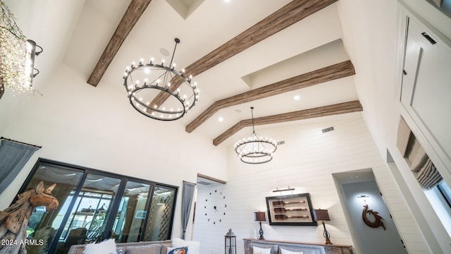 interior details featuring a chandelier and beamed ceiling