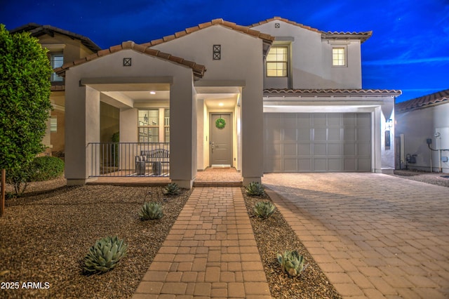 mediterranean / spanish-style home featuring a garage