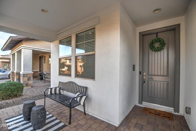 doorway to property featuring covered porch