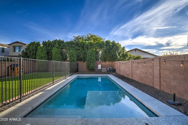 view of pool with a lawn, a fenced backyard, and a fenced in pool