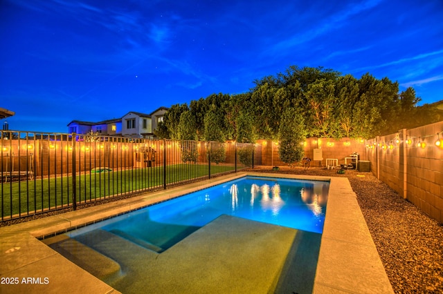 view of pool with a yard, a fenced in pool, and a fenced backyard