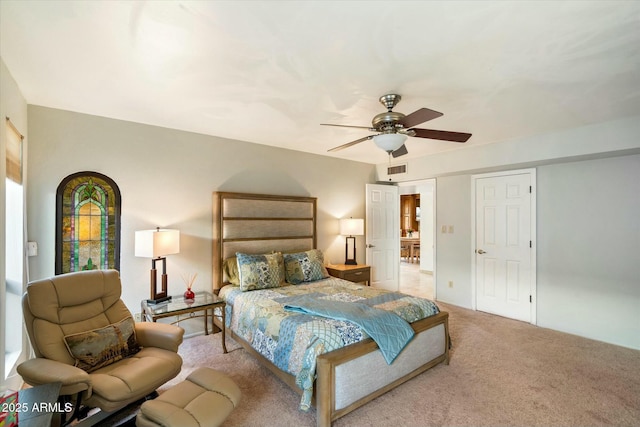 carpeted bedroom with visible vents and ceiling fan