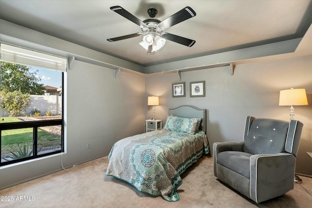 carpeted bedroom with a ceiling fan