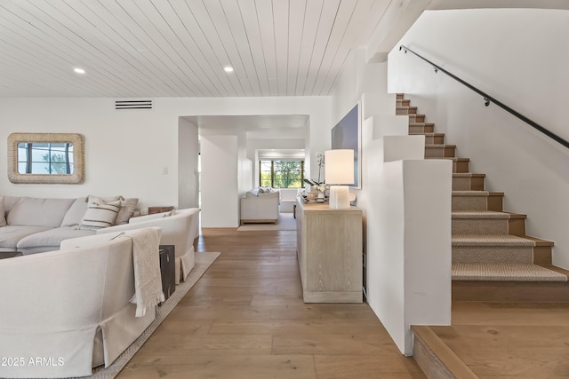 interior space with wooden ceiling, recessed lighting, visible vents, light wood-style floors, and stairs