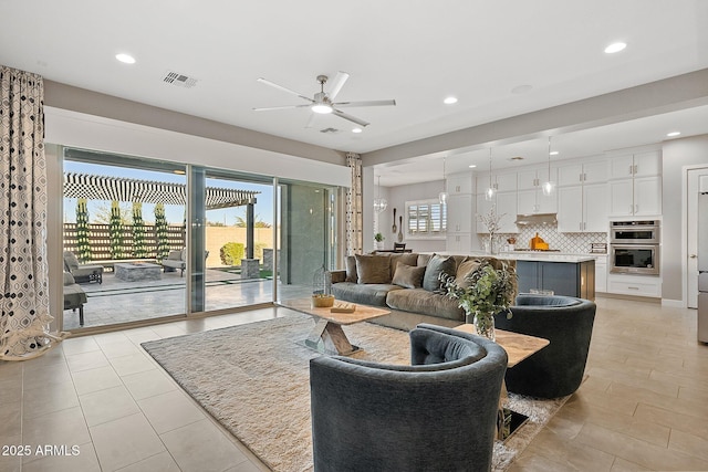 living room with ceiling fan