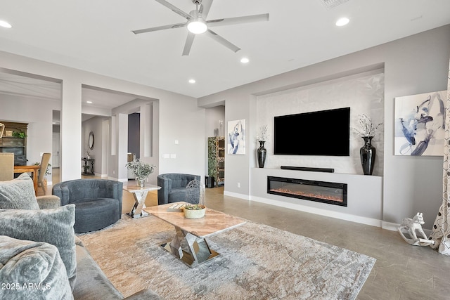 living room featuring ceiling fan and concrete floors