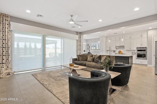 living room with ceiling fan