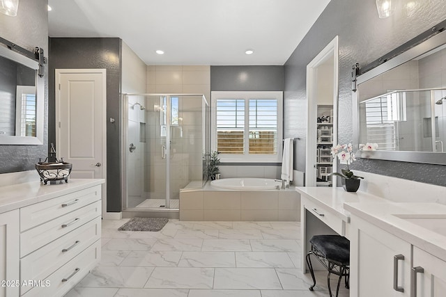 bathroom featuring vanity and shower with separate bathtub