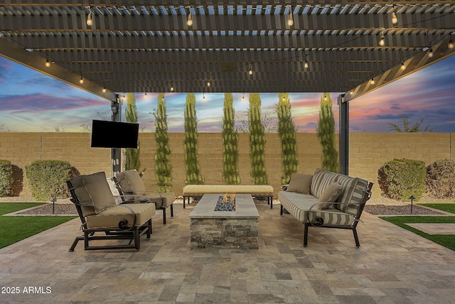 view of patio featuring a pergola and an outdoor living space with a fire pit