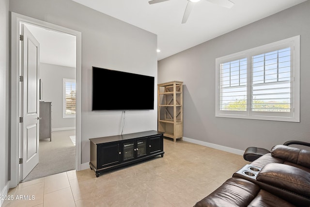 tiled living room with ceiling fan