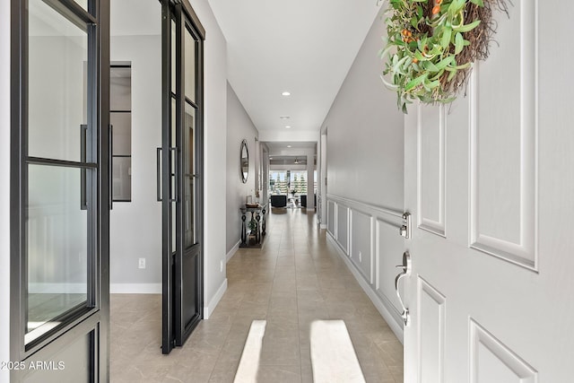 hallway with light tile patterned floors