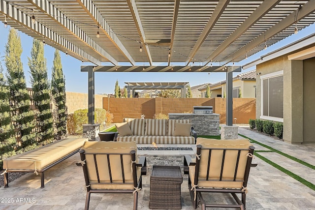 view of patio with an outdoor living space, a pergola, and exterior kitchen