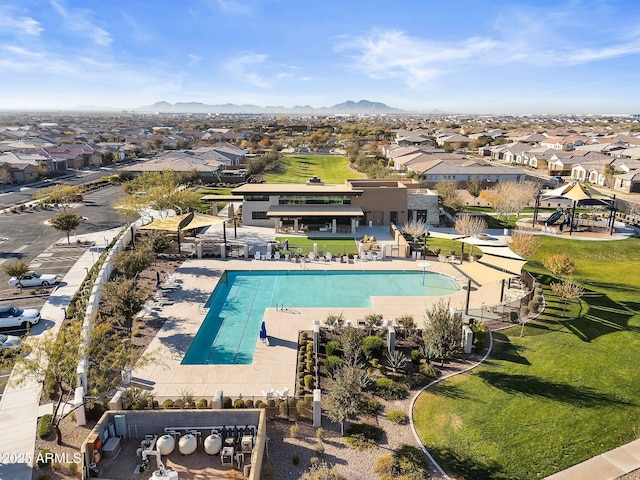 view of pool with a mountain view and a patio area