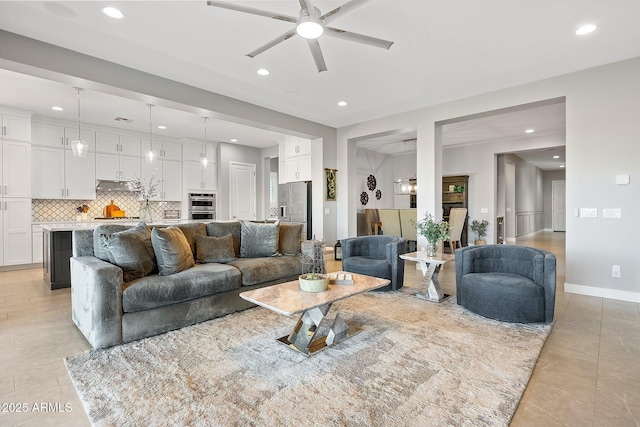 living room with light tile patterned flooring and ceiling fan