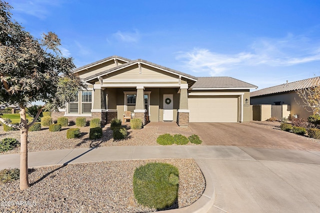 view of front of property featuring a garage and covered porch