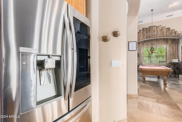 kitchen with stainless steel fridge with ice dispenser, pendant lighting, and billiards