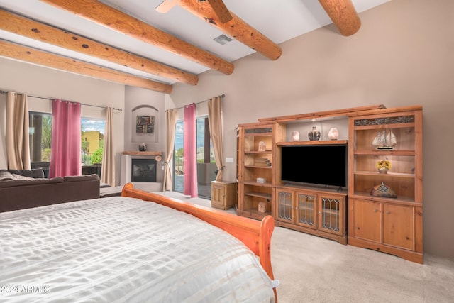 bedroom with access to outside, beam ceiling, and carpet floors