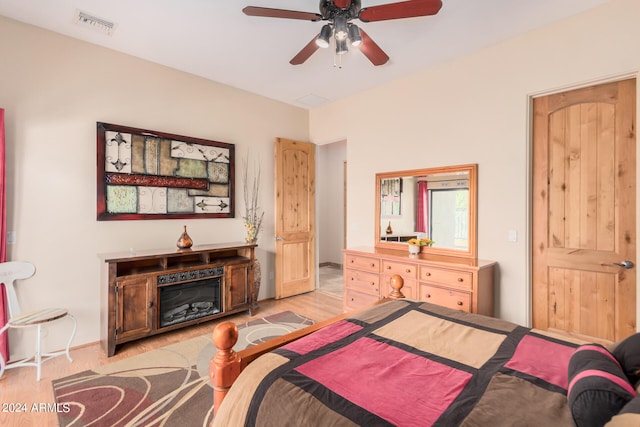 bedroom with ceiling fan and light hardwood / wood-style flooring