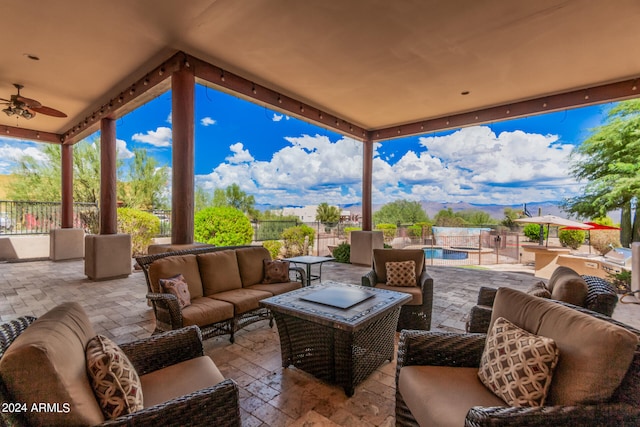 view of patio / terrace with an outdoor living space and ceiling fan