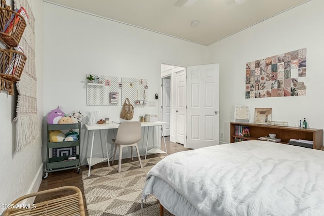 bedroom with dark wood-style floors, ceiling fan, and baseboards