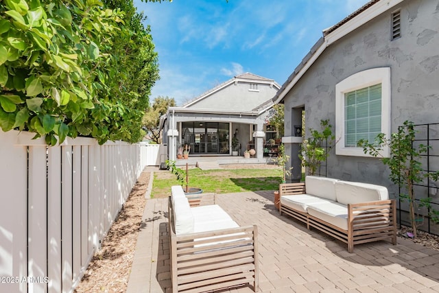 view of patio / terrace featuring a fenced backyard and an outdoor living space