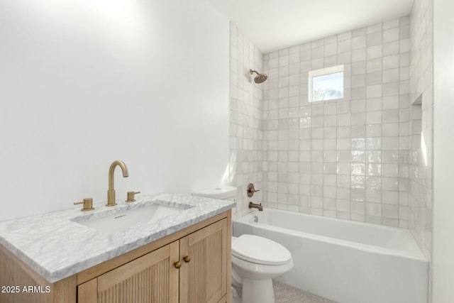 bathroom featuring bathing tub / shower combination, vanity, and toilet