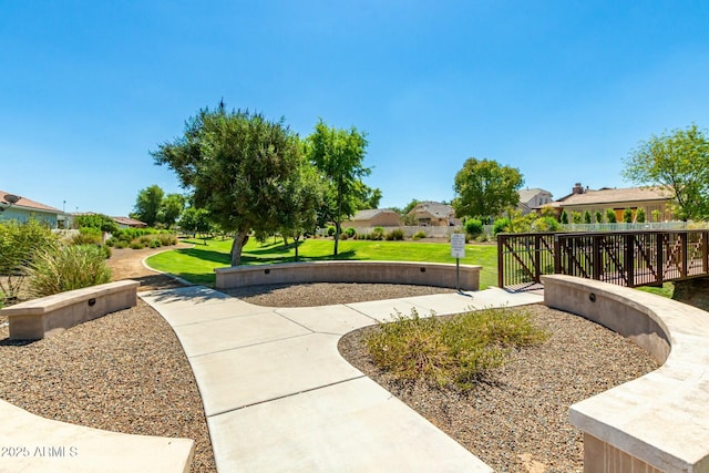 surrounding community featuring a residential view, fence, and a yard