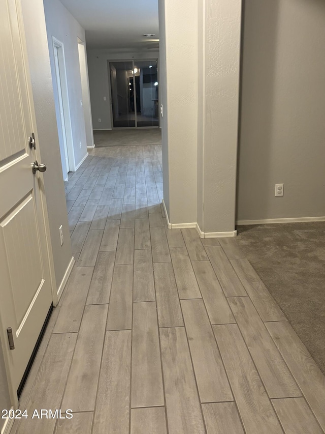 hallway featuring light wood-type flooring