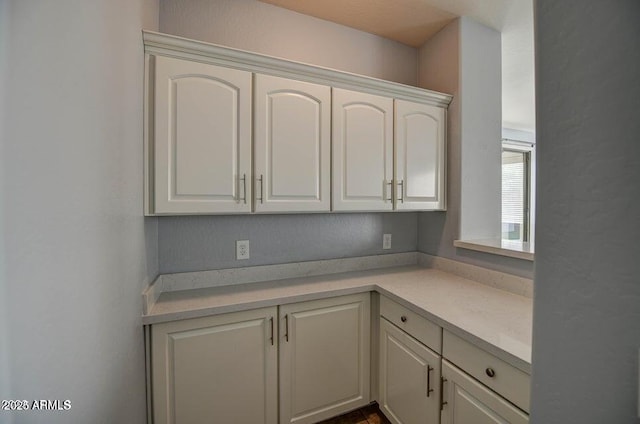 kitchen featuring white cabinets