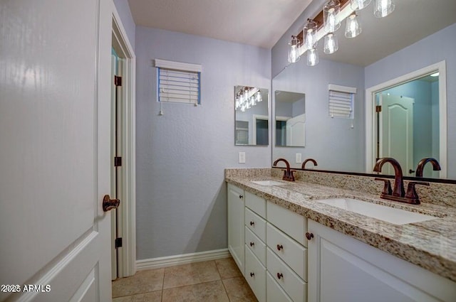 bathroom featuring tile patterned floors and vanity