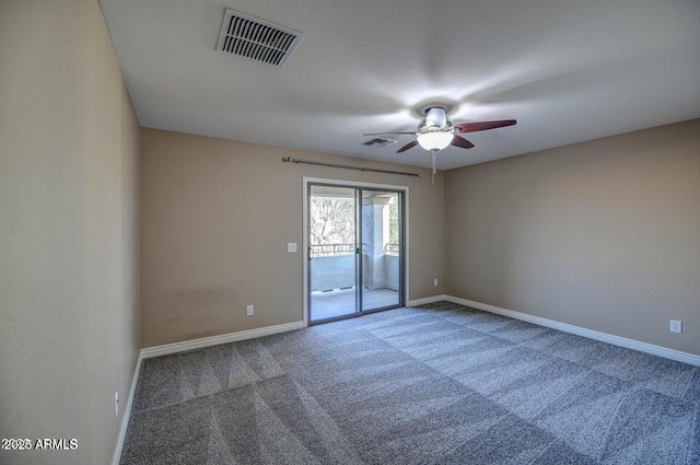 spare room with ceiling fan and carpet flooring