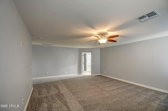 empty room with carpet and ceiling fan